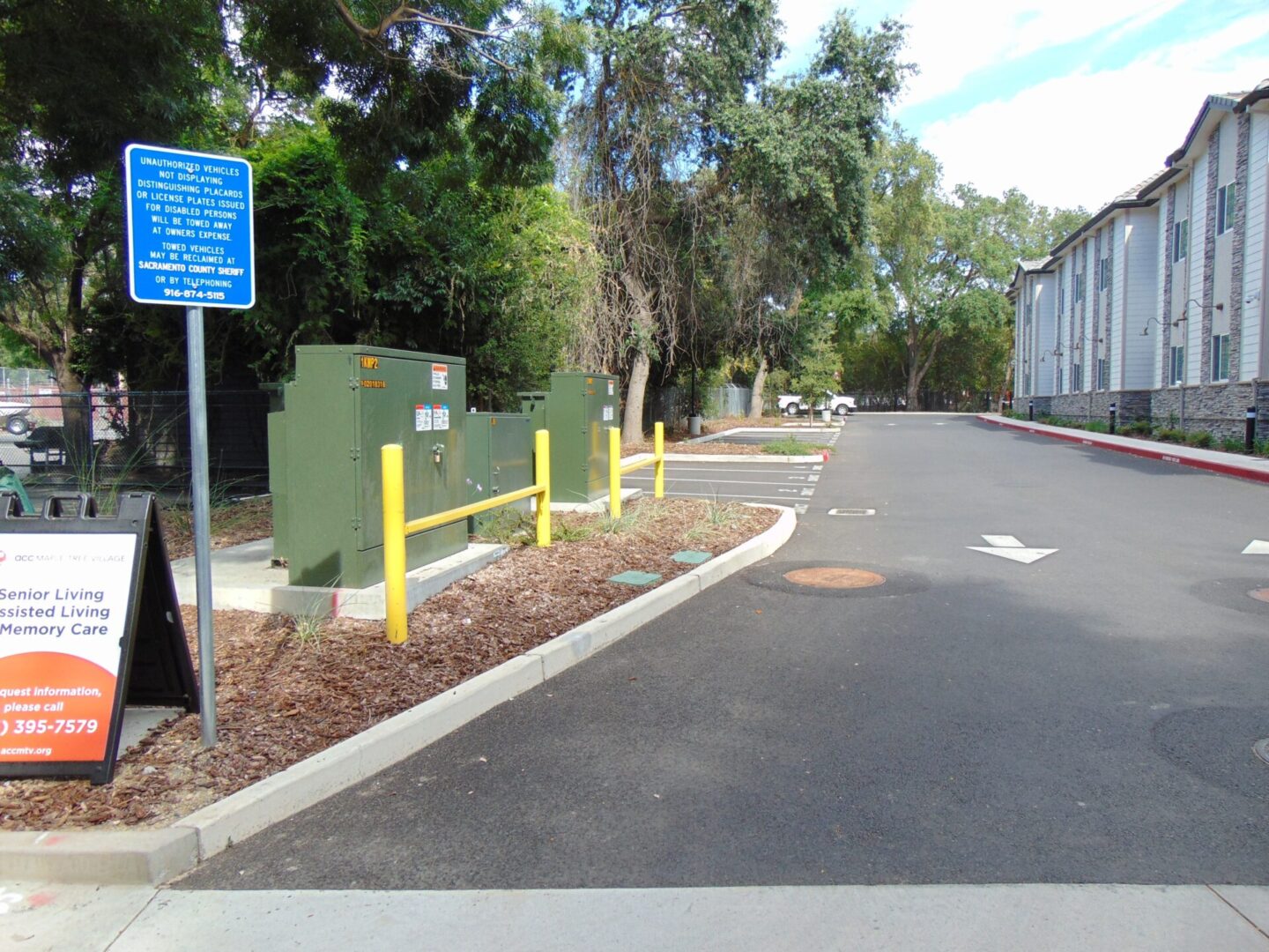 Parking lot utility infrastructure with bollards and signage
